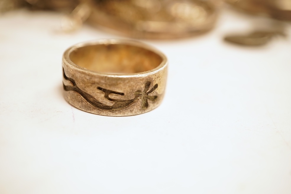 A small group of silver and white metal jewellery including Siamese enamelled bangle, silver chain, drop earrings, Persian coin brooch, etc.